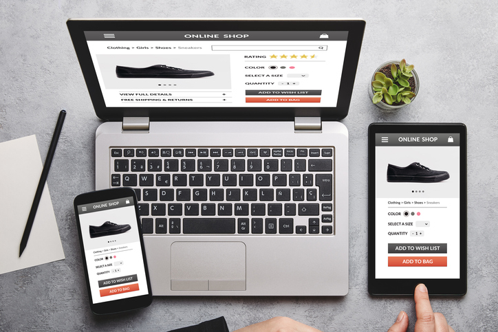 Online shop concept on laptop, tablet and smartphone screen